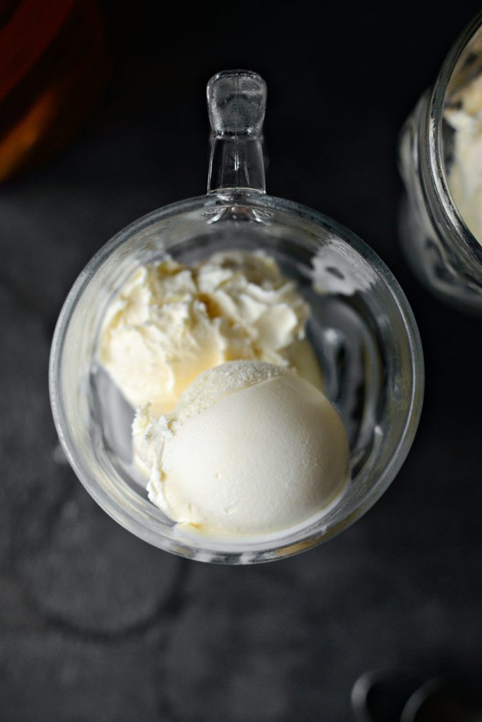 scoops of vanilla ice cream added to mugs