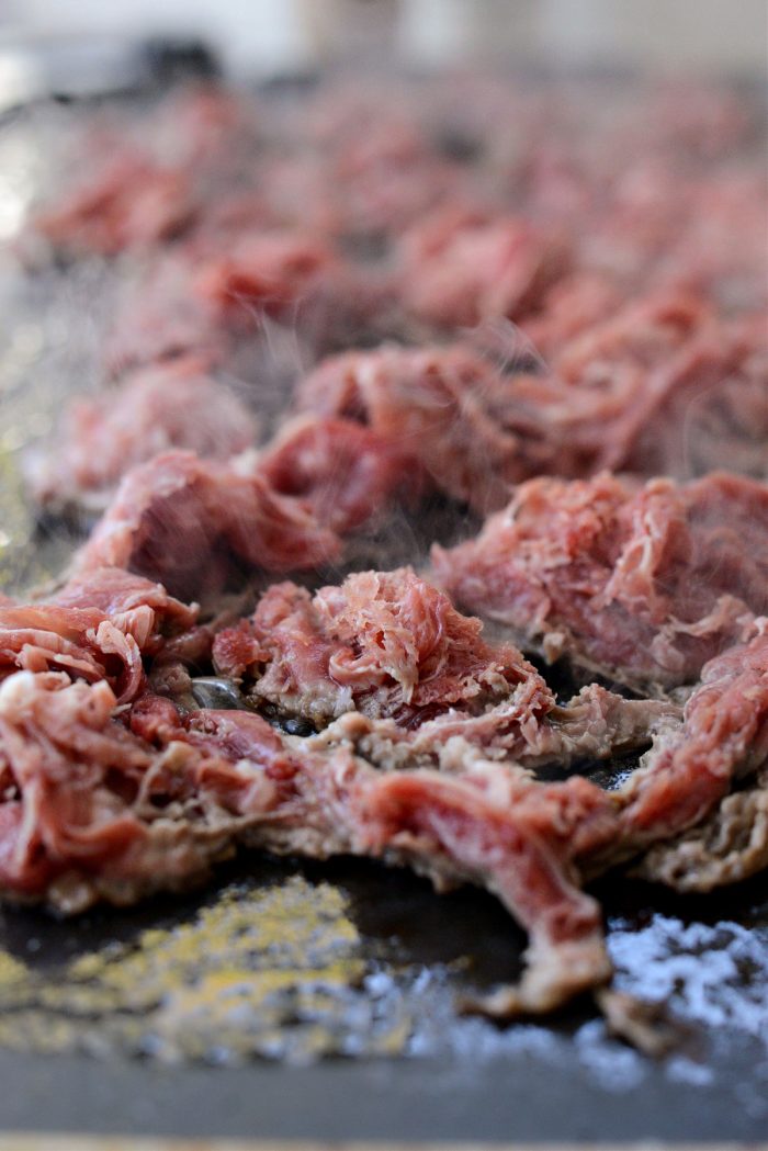 shaved steak on griddle