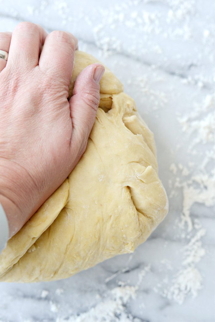 knead dough on floured surface