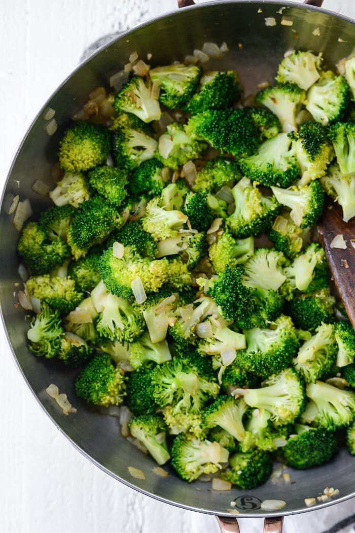 tender yet firm cooked broccoi with onions and garlic