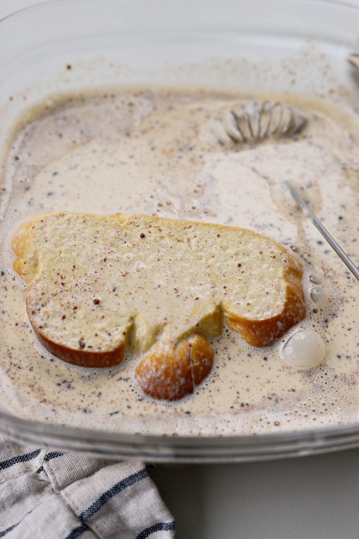 dip both sides of the sliced challah into custard