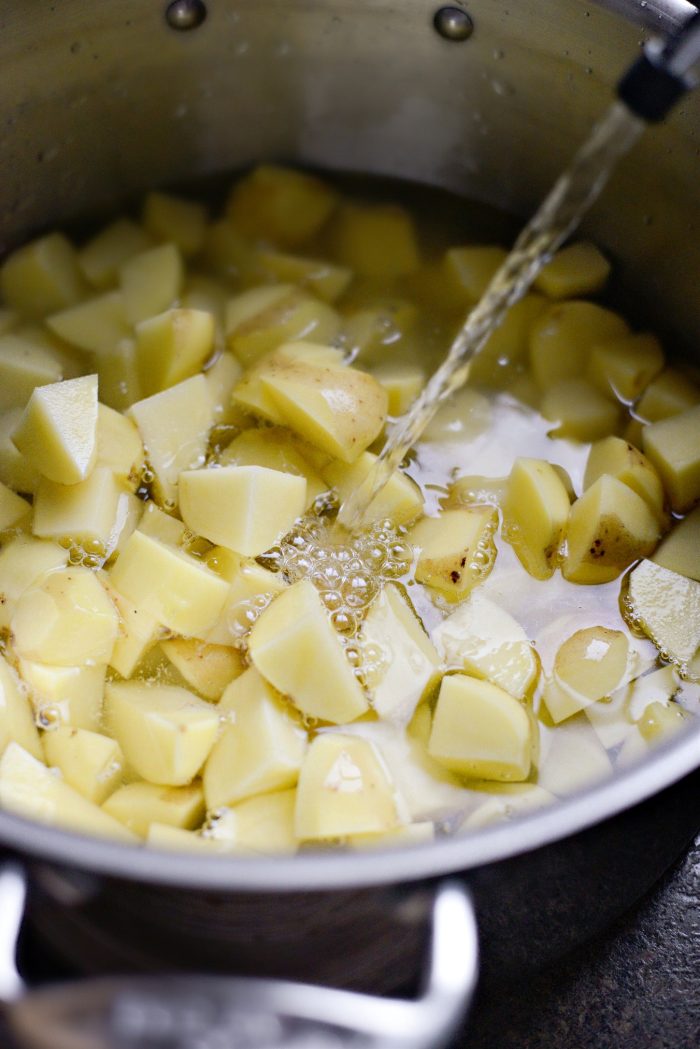 add cubed potatoes and cold water to pot