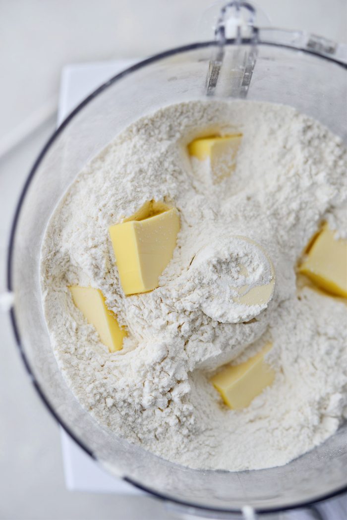 Place sifted ingredients and butter in food processor