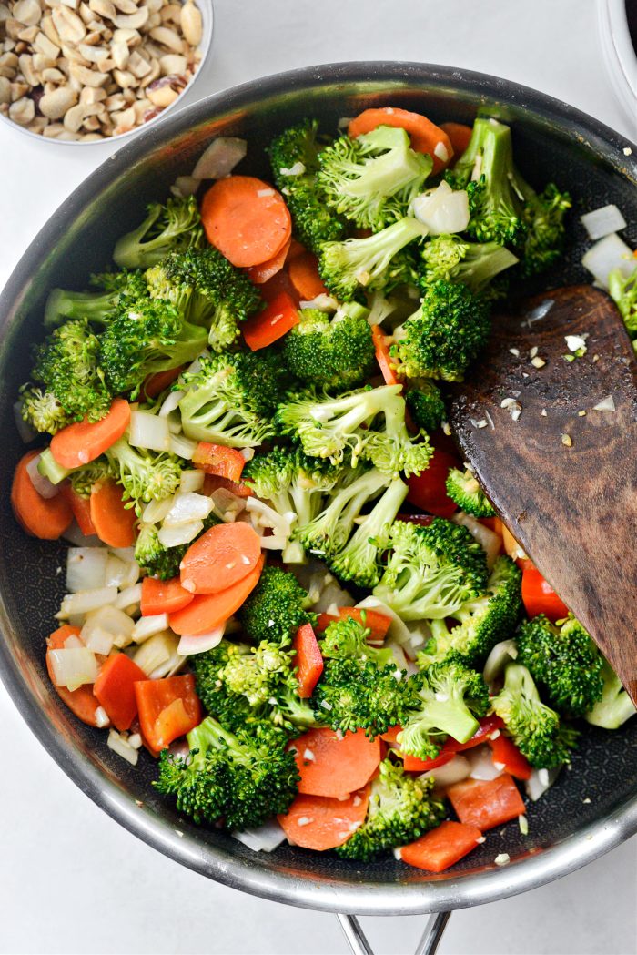 Toss the vegetables in the fat in the pan.