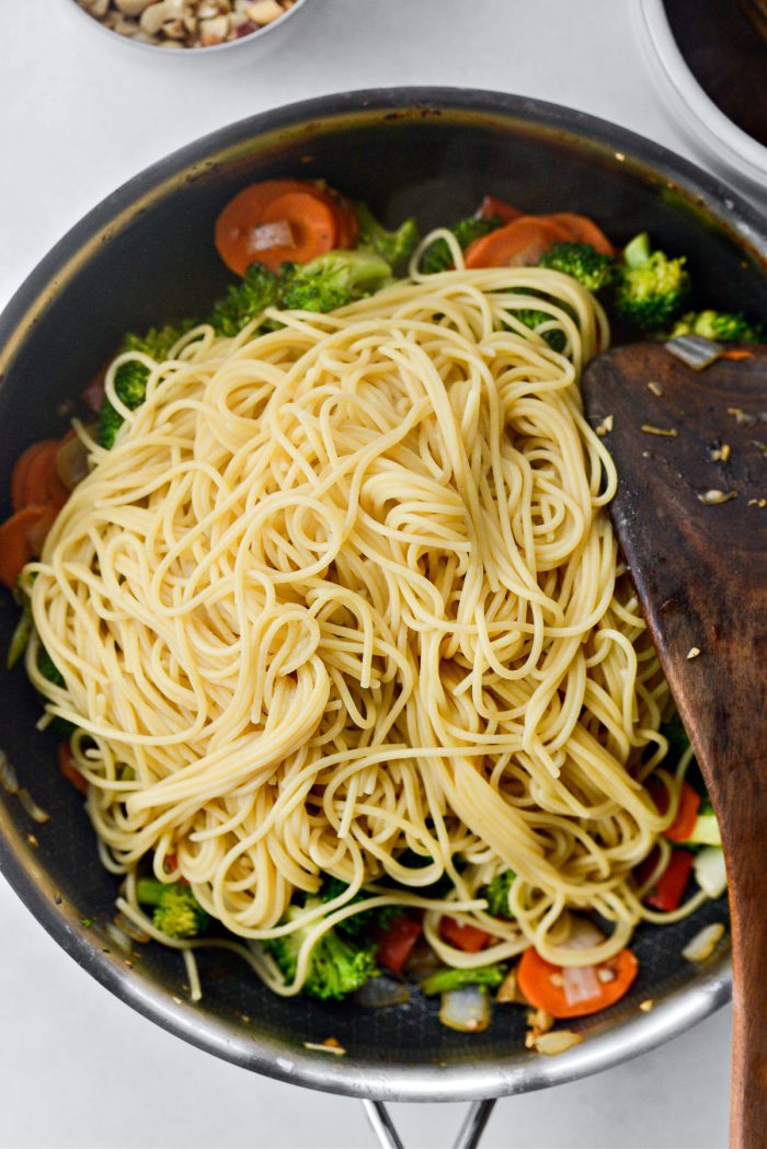 add cooked pasta to veggies in pan.
