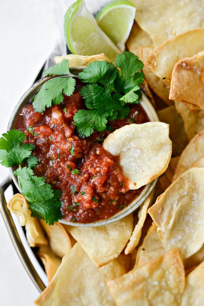 chip in bowl of homemade salsa