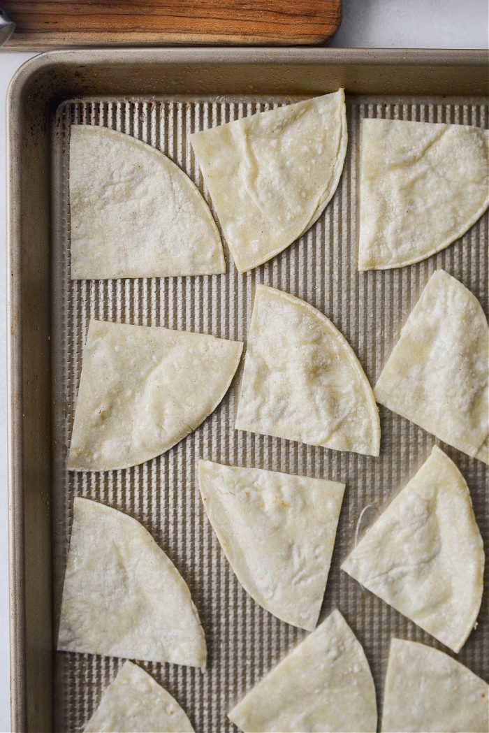 Spray both sides of the quartered tortillas 