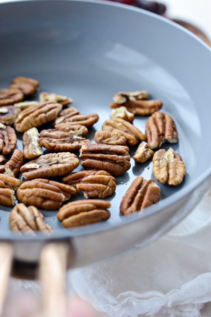 toasted pecans in skillet.