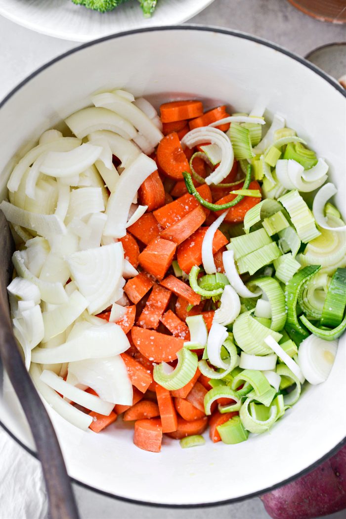 Add the carrots, onions and leeks to the pot with some kosher salt.