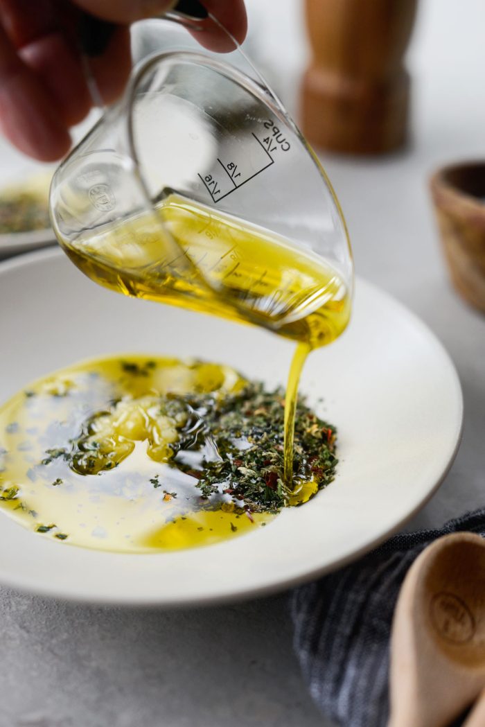 pour 3 tablespoons evoo onto each plate