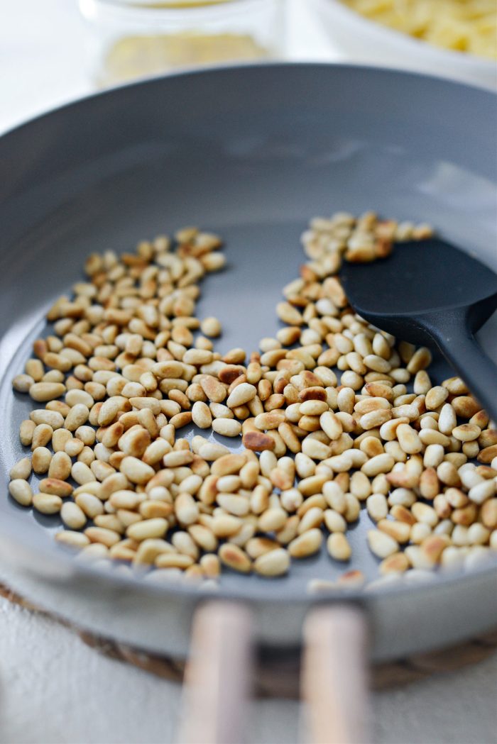 toasted pine nuts in small skillet