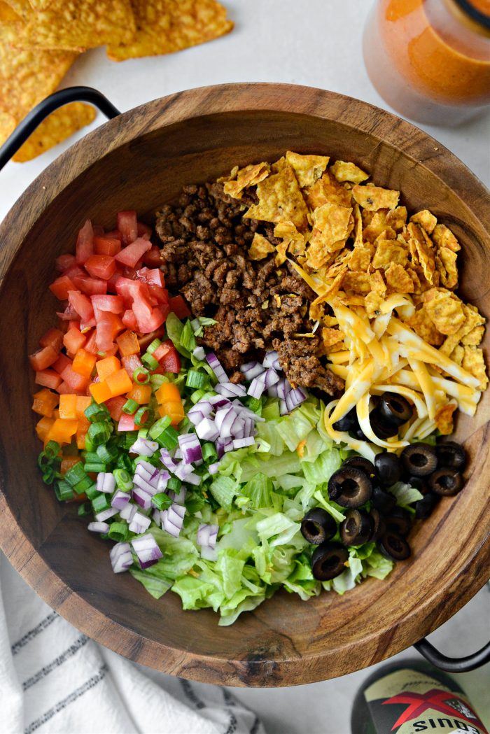 taco salad ingredients in bowl.