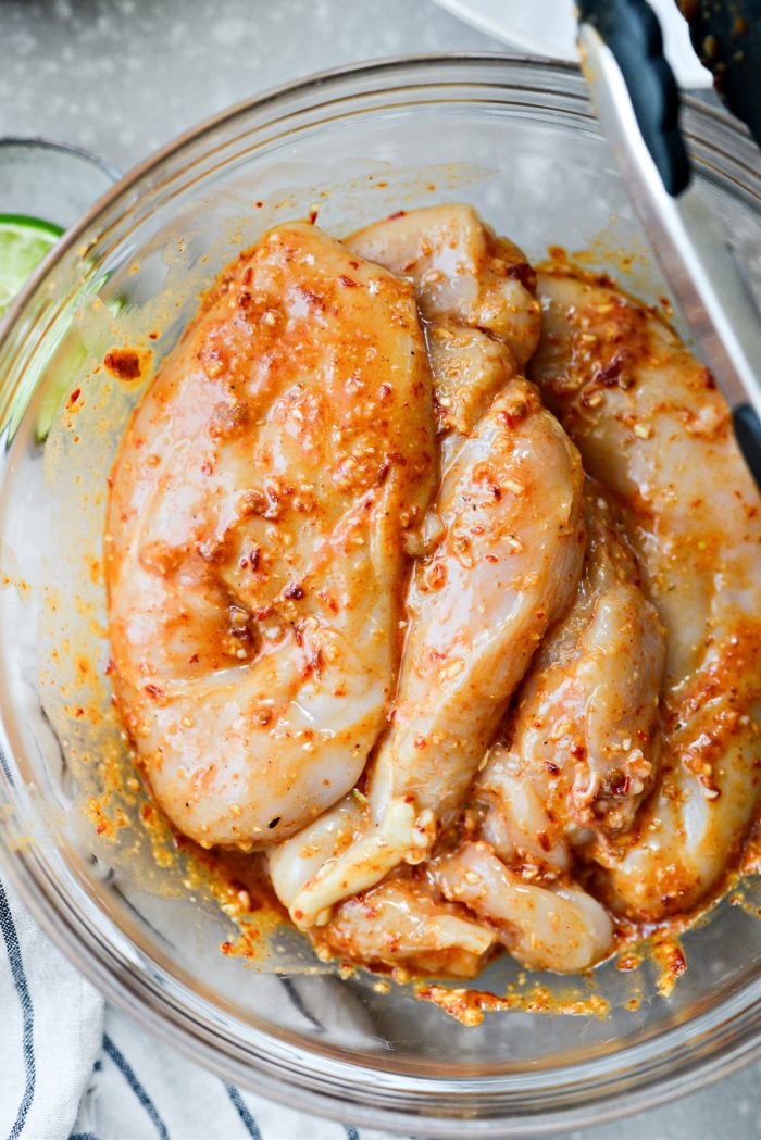 toss the chicken in the marinade and coat evenly