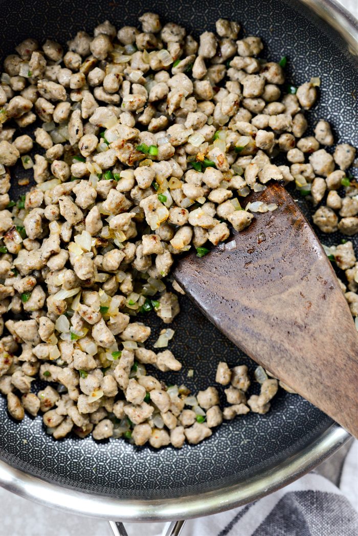 Sauté onion and brown sausage crumbles.