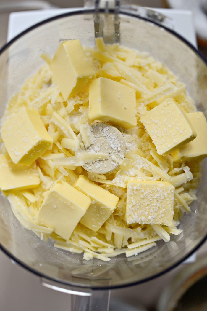 add flour, cheese, butter and salt to a food processor