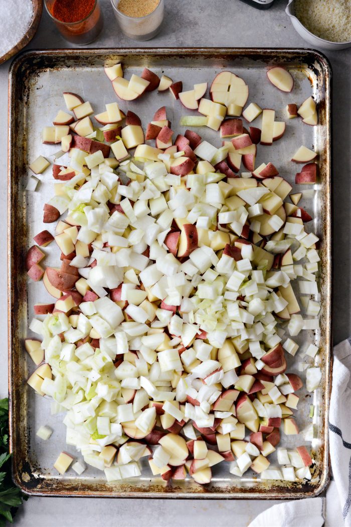 potatoes, fennel and onion on roasting sheet pan