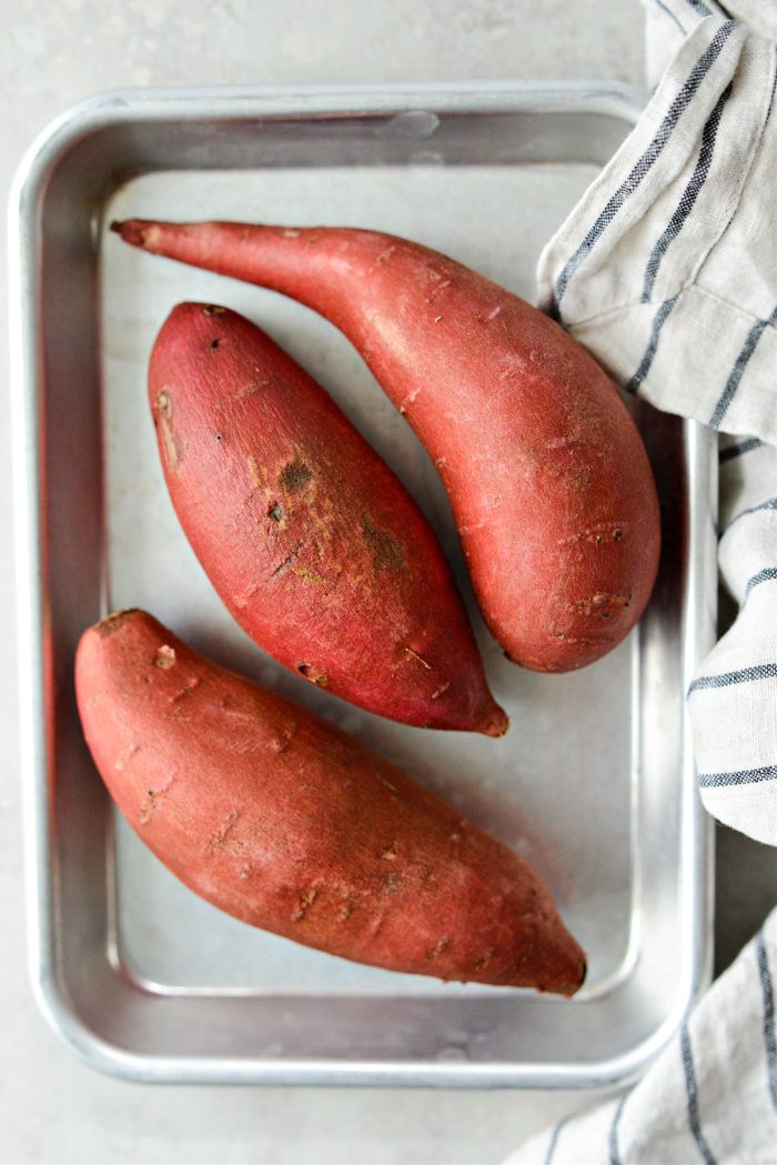clean and pat dry your sweet potatoes before placing on a rimmed baking sheet