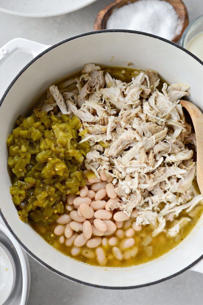 add the chicken back to the pot with green chiles and beans