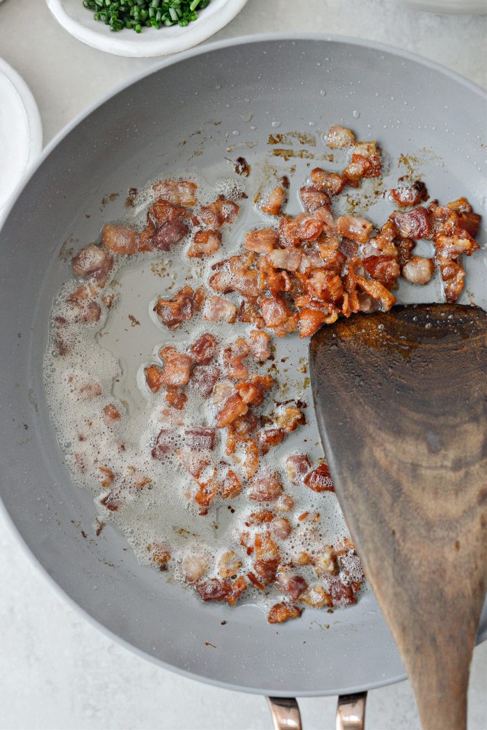 crisped bacon pieces in skillet