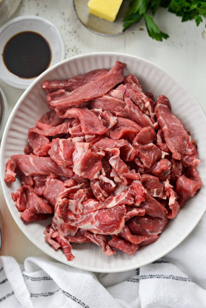 thinly sliced steak in bowl