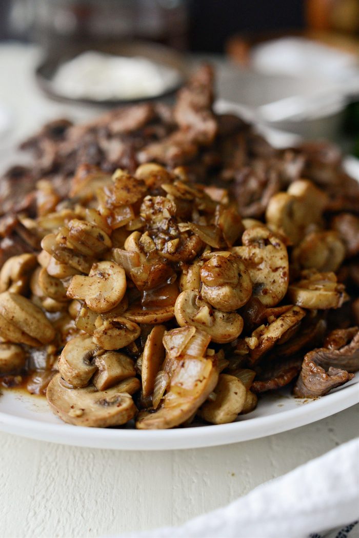 transfer mushroom mixture to plate with beef