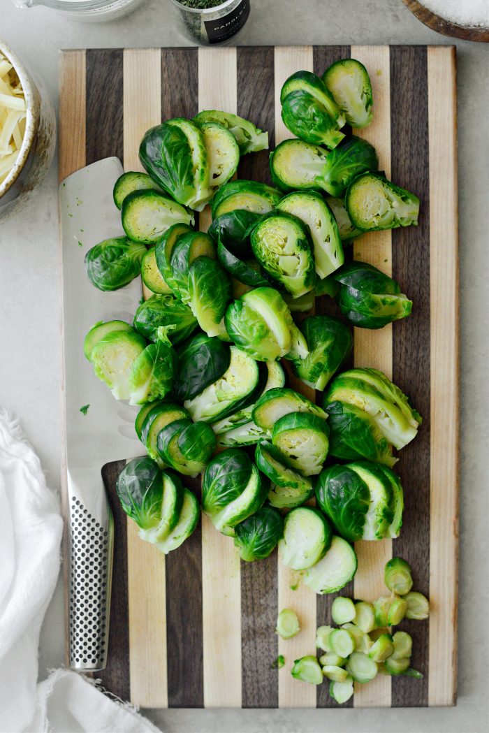 trim ends and slice brussels sprouts.