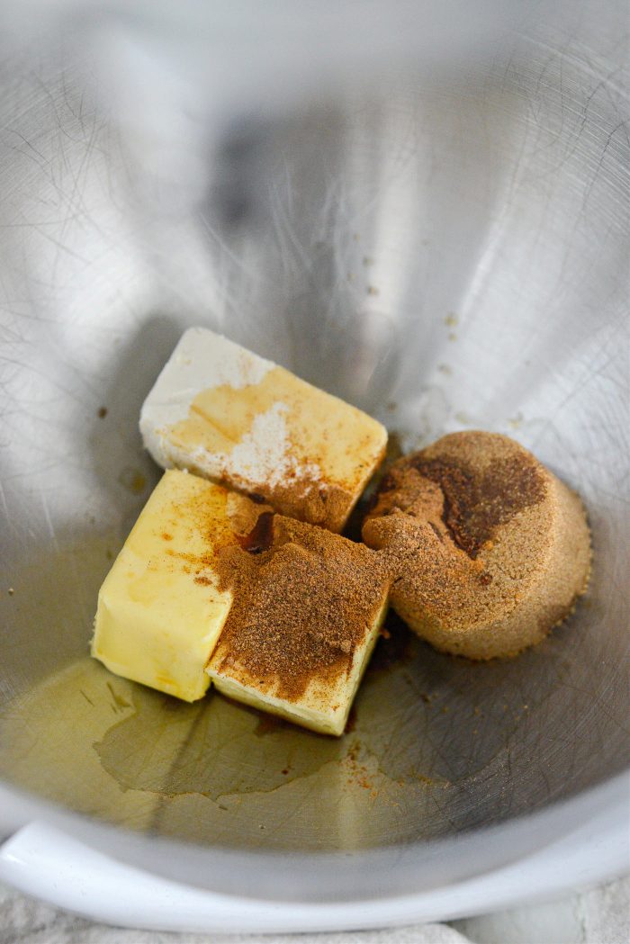 cream cheese, butter, cinnamon, nutmeg and brown sugar in mixing bowl