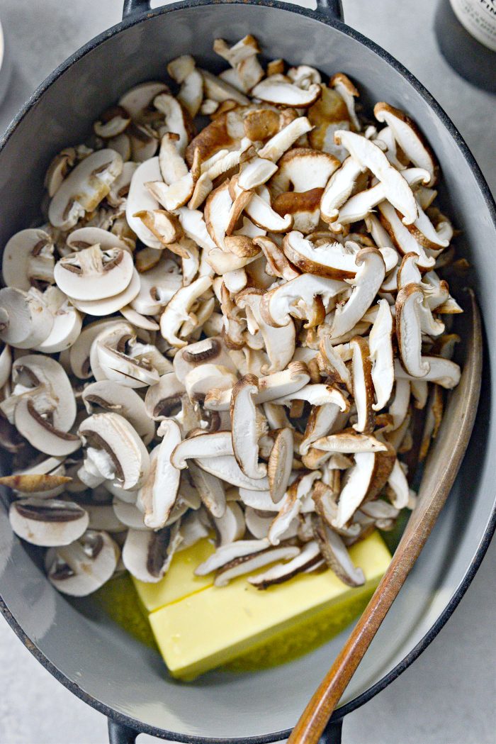 sliced mushrooms and butter in pot