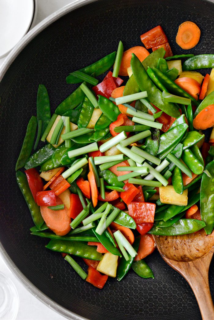 Add in green onions and stir-fry 2 minutes