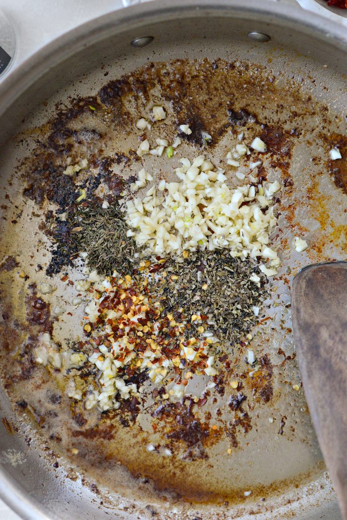 add garlic, herbs and spices to pan