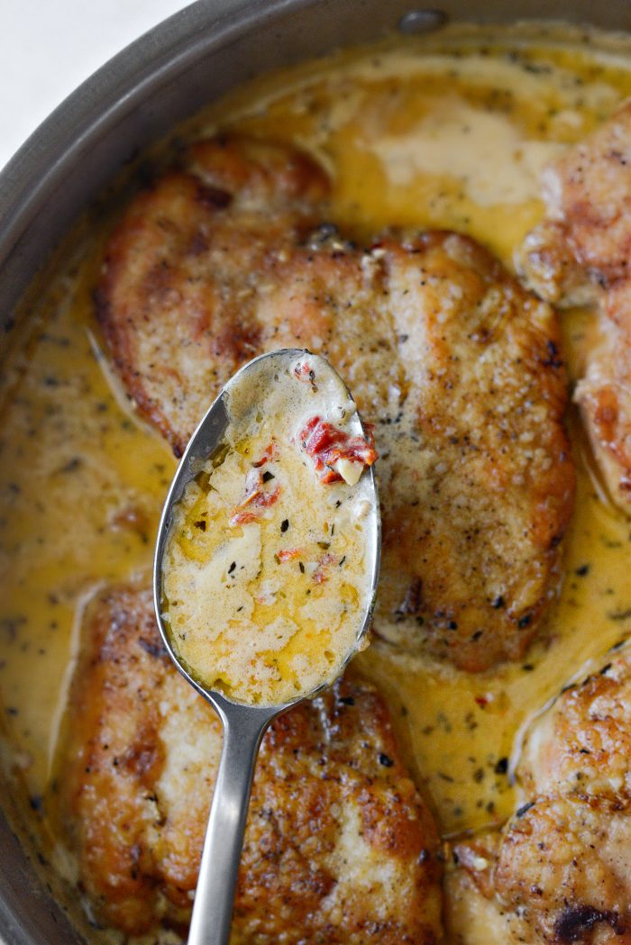 spoon sauce over chicken