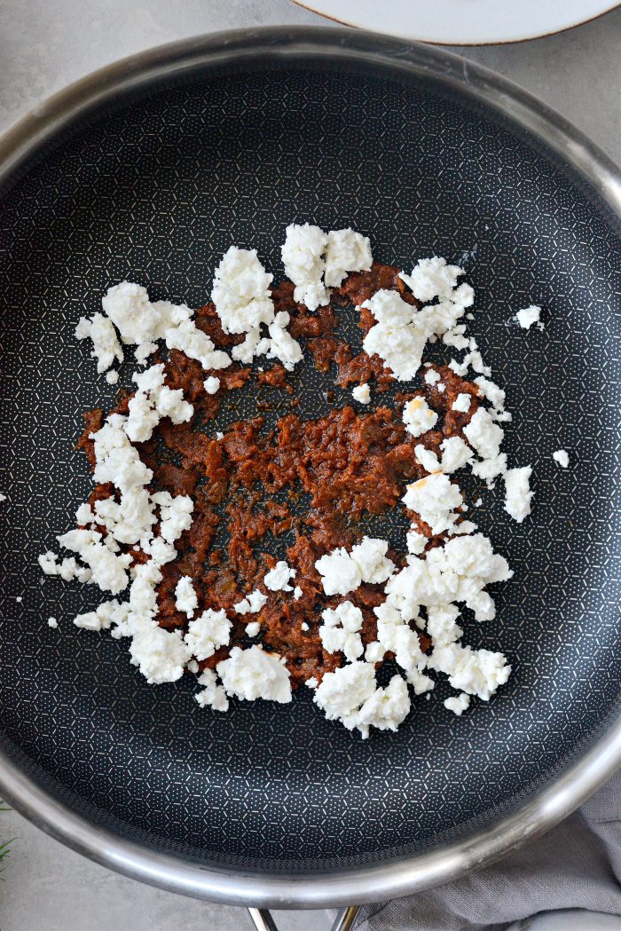 pesto and feta in a skillet