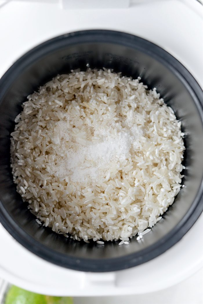add rice and salt to rice cooker