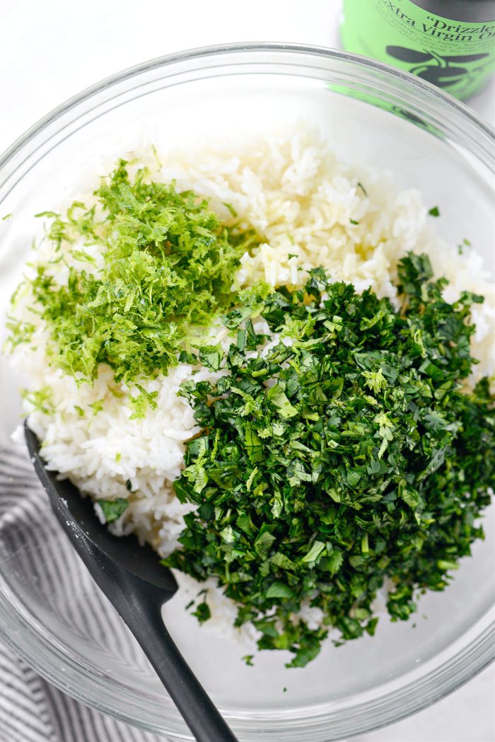 add rice to bowl with cilantro, lime zest and juice and oil.