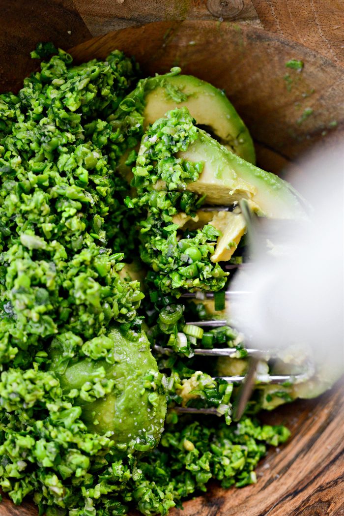add avocados, pea and Serrano mixture, green onion, lime juice and salt