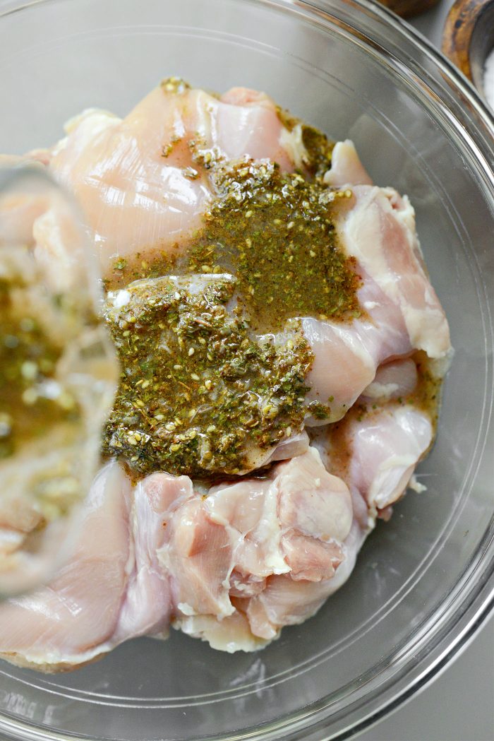 pour marinade over chicken thighs