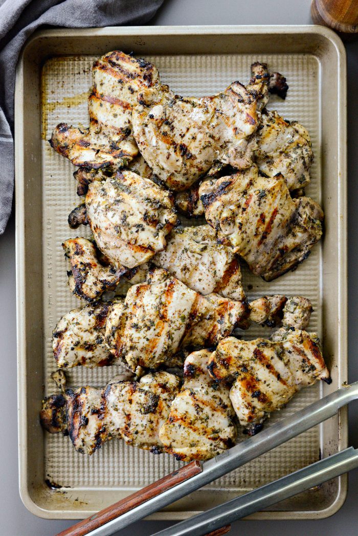 Grilled chicken thighs on tray