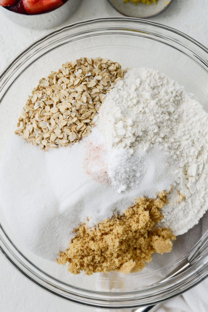 oats, flour, sugars, baking soda and powder, salt in bowl