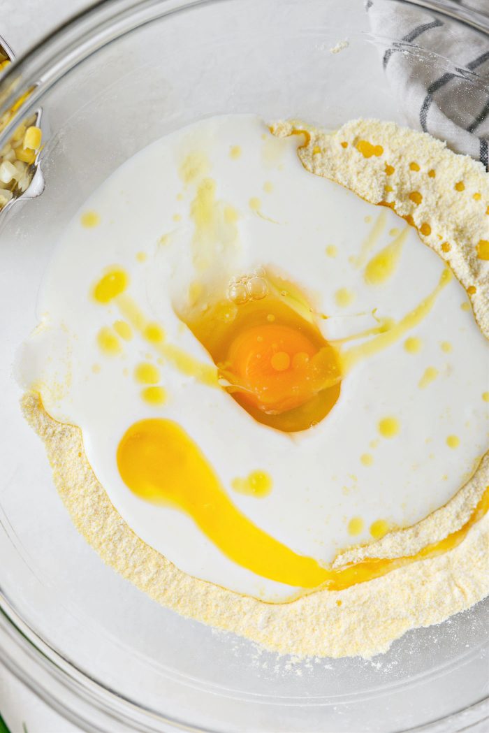 make a well and pour in buttermilk, add egg and melted butter