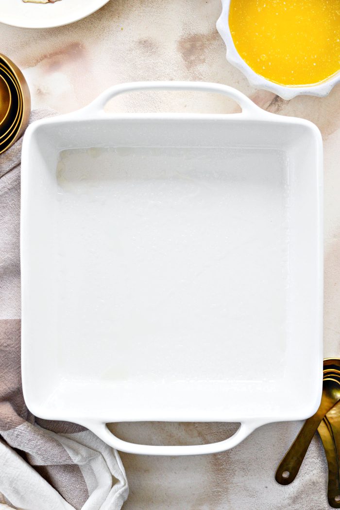 preheat oven and lightly grease baking dish