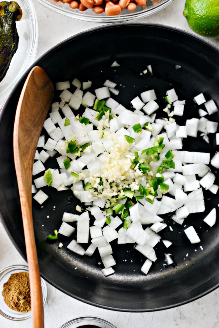 oil, onions, garlic, jalapeño and pinch of salt in pan