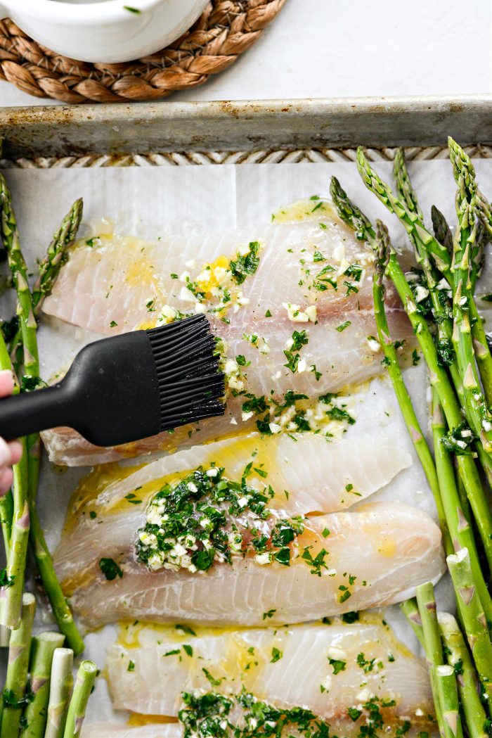 brush lemon garlic butter over fish