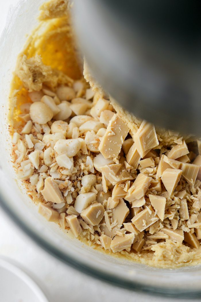 add in chopped macadamia nuts and white chocolate