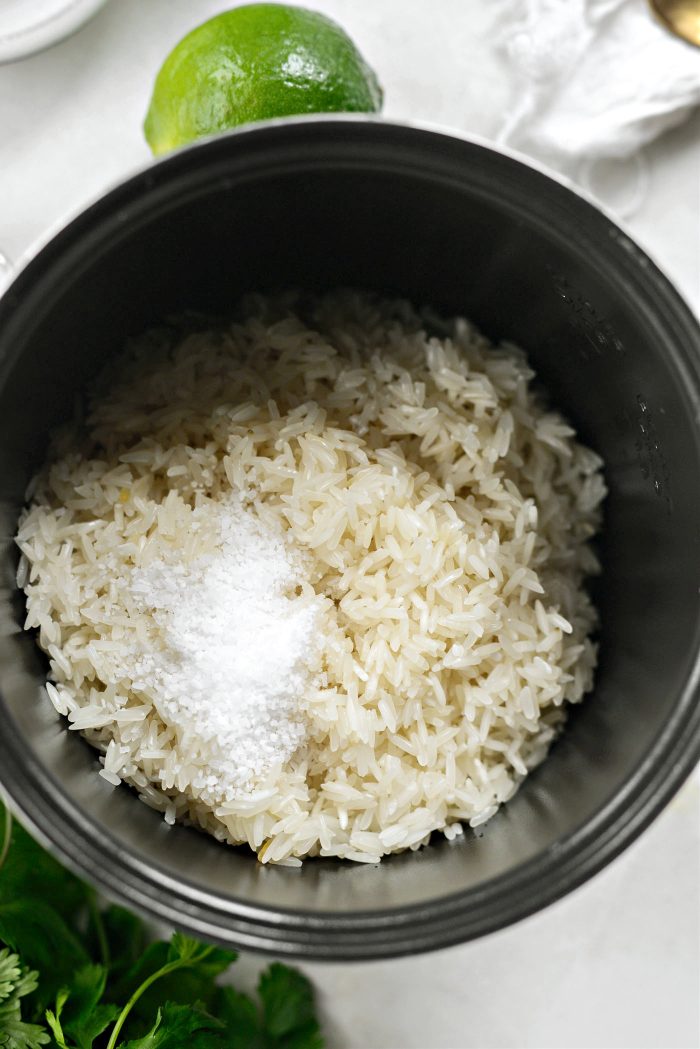 add rinsed rice and salt to rice cooker