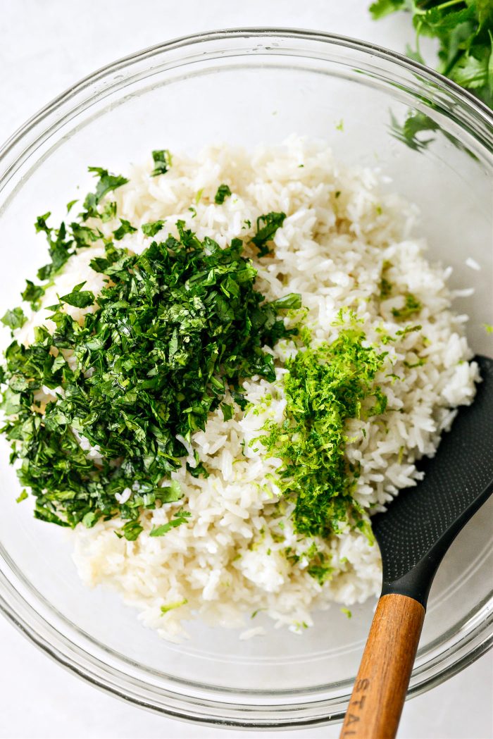 add rice to bowl with coconut oil, chopped cilantro and the lime zest