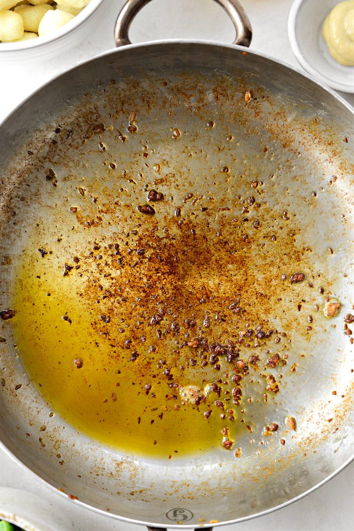 remove sausage, leaving fat in the pan