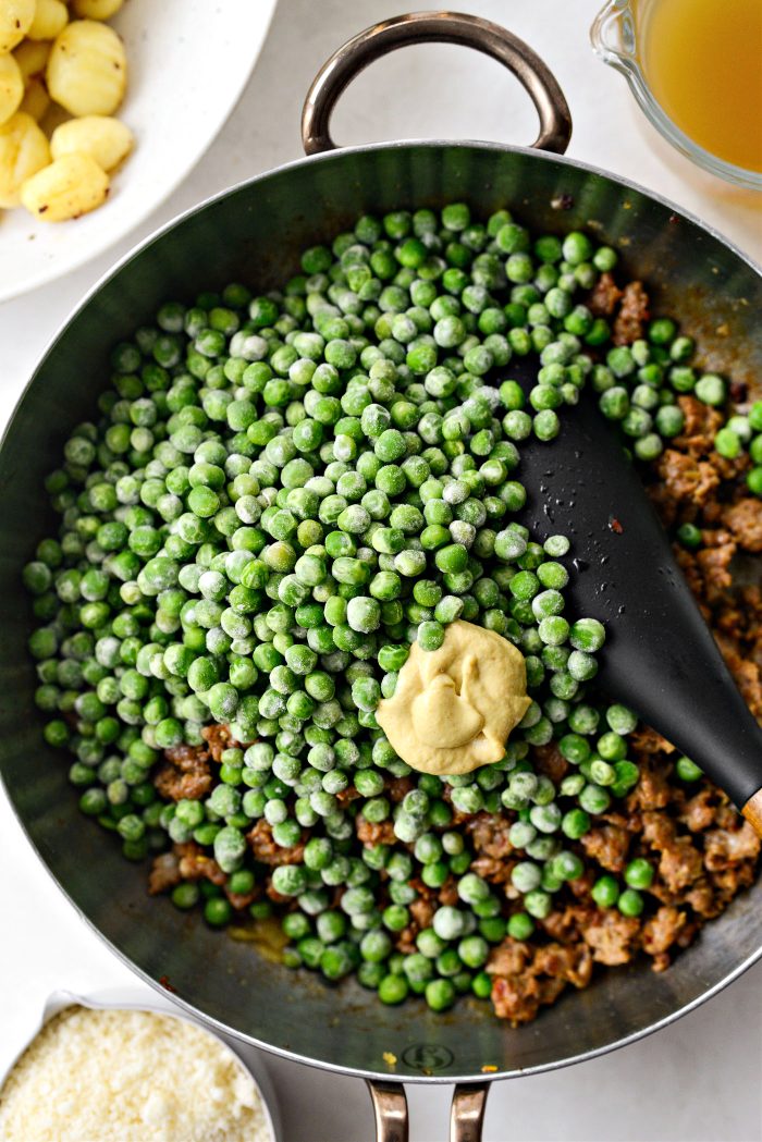then add frozen peas and dijon