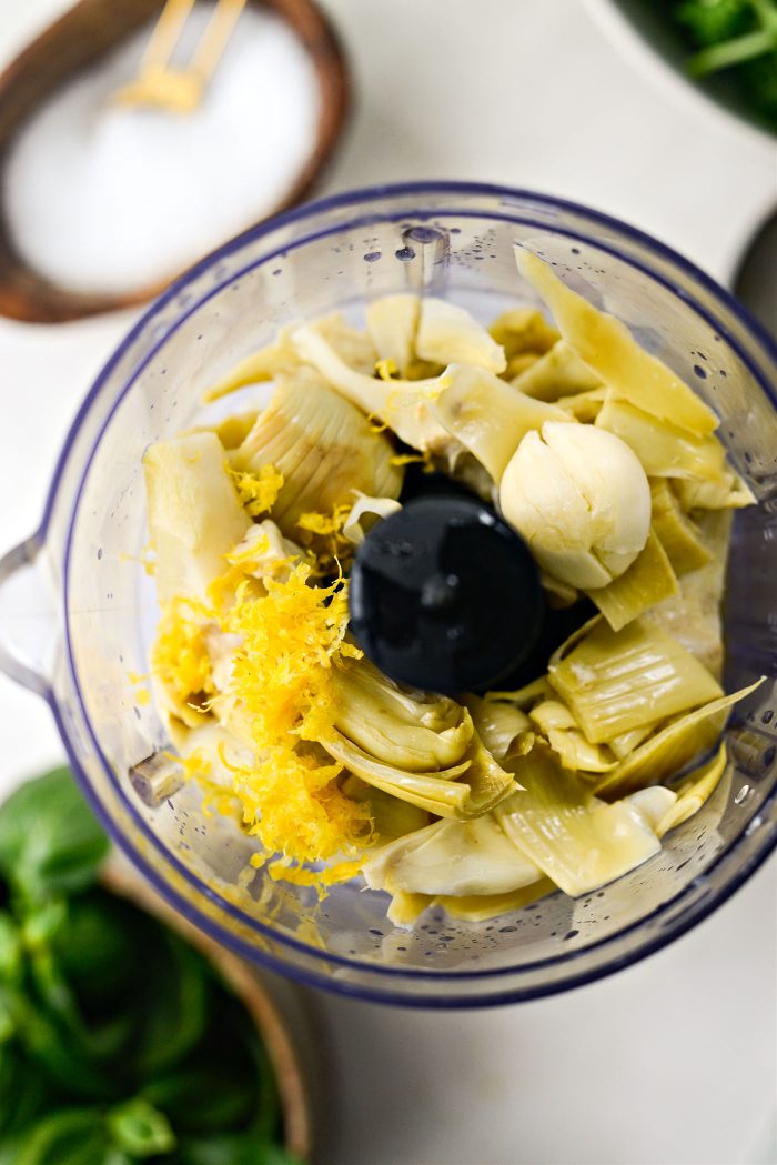 artichokes, garlic, lemon zest and juice in food processor