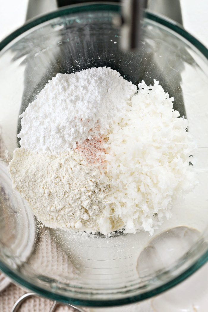 flour, coconut, powdered sugar and salt in mixer