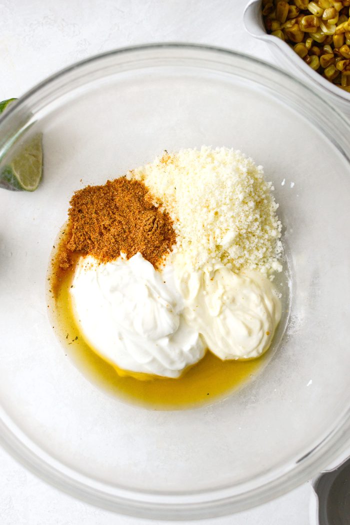 add, mayo, greek yogurt, lime juice, honey, cotija and elote seasoning to a bowl